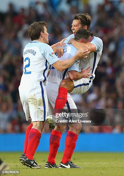 Mark Wright of England celebrates his goal with Jamie Carragher during the Soccer Aid 2016 match in aid of UNICEF at Old Trafford on June 5, 2016 in...