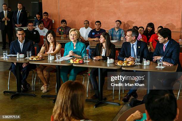 Congressman Xavier Becerra, left, Clara Kim , Democratic presidential candidate Hillary Clinton, Italia Garcia, Mayor Eric Garcetti and California's...