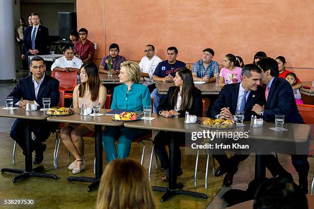 Congressman Xavier Becerra, left, Clara Kim , Democratic presidential candidate Hillary Clinton, Italia Garcia, Mayor Eric Garcetti and California's...