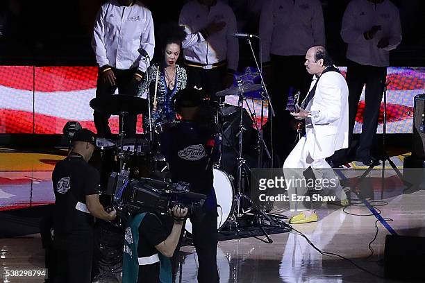 Carlos Santana and his wife Cindy Blackman perform the national anthem prior to Game 2 of the 2016 NBA Finals between the Golden State Warriors and...