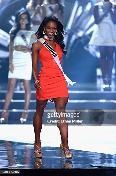 Top 15 finalist Miss Virginia USA 2016 Desi Williams walks onstage during the 2016 Miss USA pageant at T-Mobile Arena on June 5, 2016 in Las Vegas,...