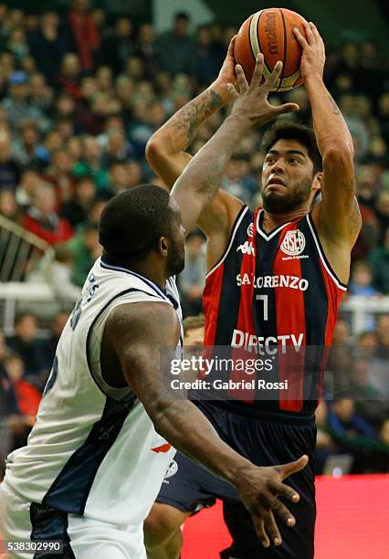 Nicolas Aguirre of San Lorenzo fights for the ball with Anthony Johnson of Bahia Basket during a match between San Lorenzo and Weber Bahia as part of...