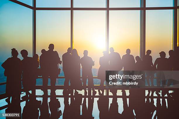 silhouettes of people at sunset - arab woman silhouette stock pictures, royalty-free photos & images
