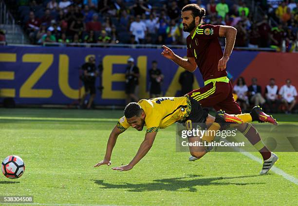 Oswaldo Vizcarrondo of Venezuela of fights for the ball with Jobi McAnuff of Jamaica during a group C match between Jamaica and Venezuela at Soldier...