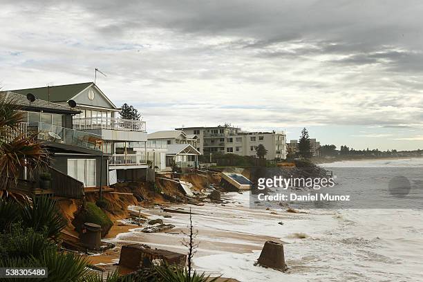 Evacuated houses are hit by big waves after torrential rains at Collaroy beach on June 6, 2016 in Sydney, Australia. Torrential rain over the weekend...