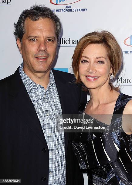 Actress Sharon Lawrence and husband Dr. Tom Apostle attend the 2016 LA Greek Film Festival premiere of "Worlds Apart" at the Egyptian Theatre on June...
