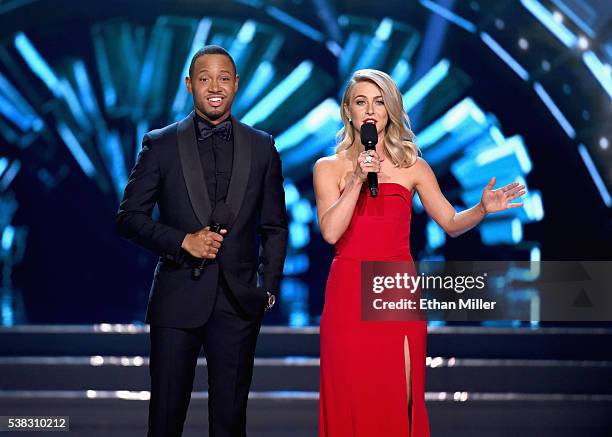 Co-hosts Terrence J and Julianne Hough speak onstage during the 2016 Miss USA pageant at T-Mobile Arena on June 5, 2016 in Las Vegas, Nevada.