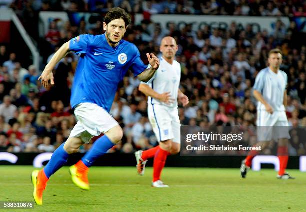 Actor Iwan Rheon plays during Soccer Aid at Old Trafford on June 5, 2016 in Manchester, England.