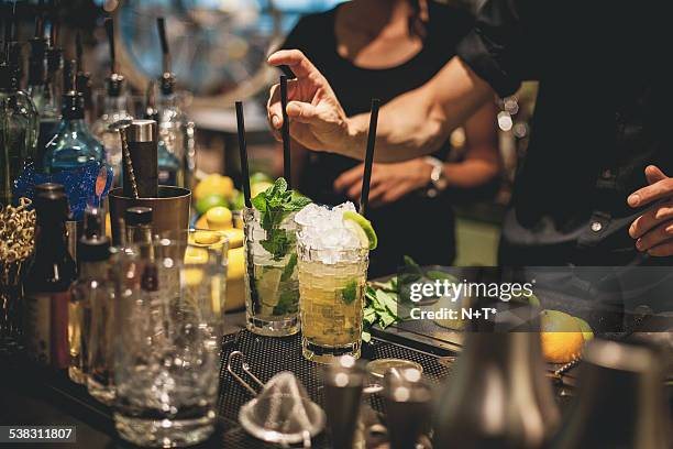 preparing cocktails - mojito stock pictures, royalty-free photos & images