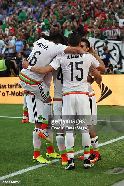 Rafael Marquez of Mexico celebrates with teammates after scoring the second goal of his team during the second half of a group C match between Mexico...