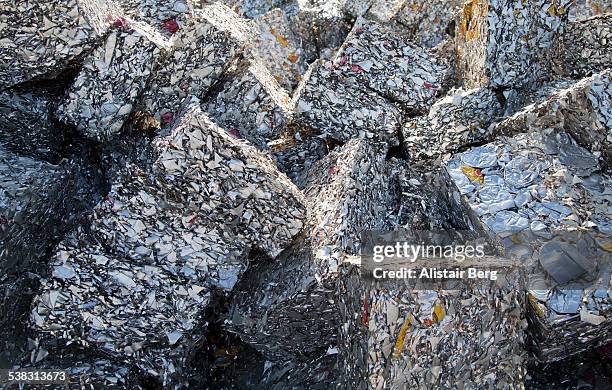 recycled blocks of aluminium in scrap yard - アルミ ストックフォトと画像