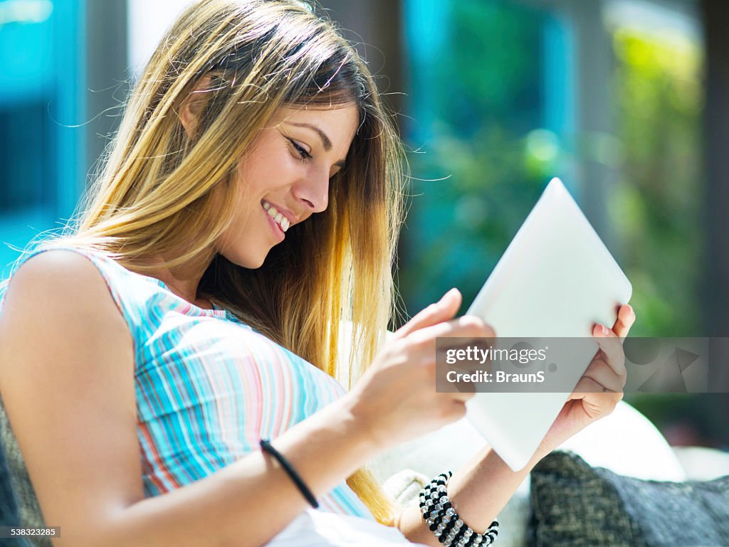 Smiling woman using touchpad.