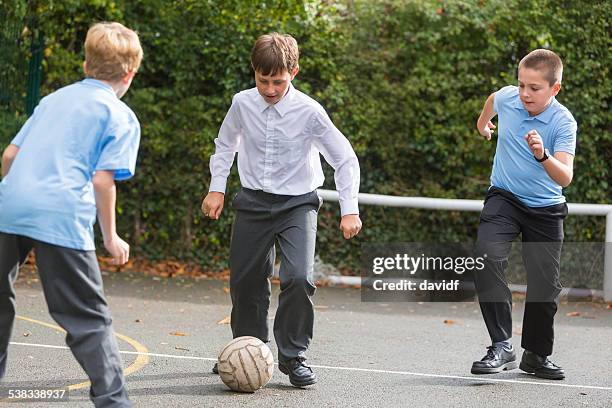 school yard soccer competition - boy playing soccer stock pictures, royalty-free photos & images