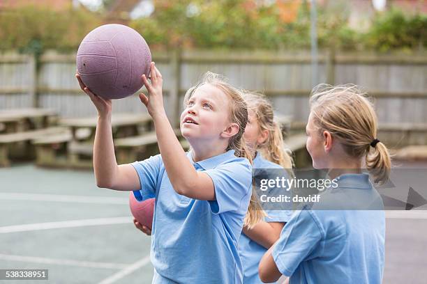 school yard netball sport girls - british basketball stock pictures, royalty-free photos & images