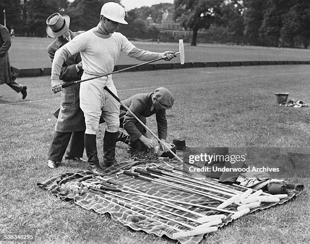 American player Stewart B Inglehart choosing his polo stick at an International Trial Polo match, Paris, France, May 30, 1936.