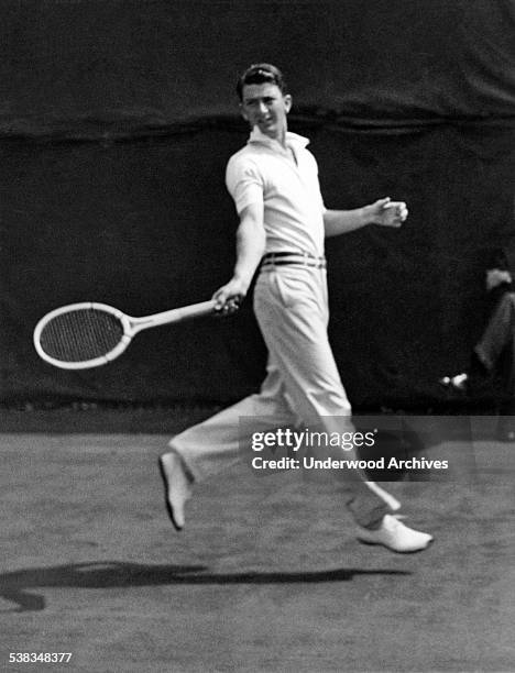 John Van Ryn of the United States returns a backhand against Jack Wright of Canada in Davis Cup play today, Philadelphia, Pennsylvania, circa 1929.