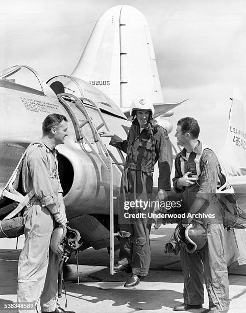Student test pilot Lt Richard Dennen gets a sendoff in an F-80 Shooting Star at Wright-Patterson Air Force Base from two of the Flight Test...