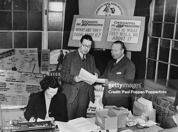 English architect Alfred Bossom , the Conservative Party candidate for Maidstone with his agent in his Committee Rooms in Maidstone, Kent, in the...