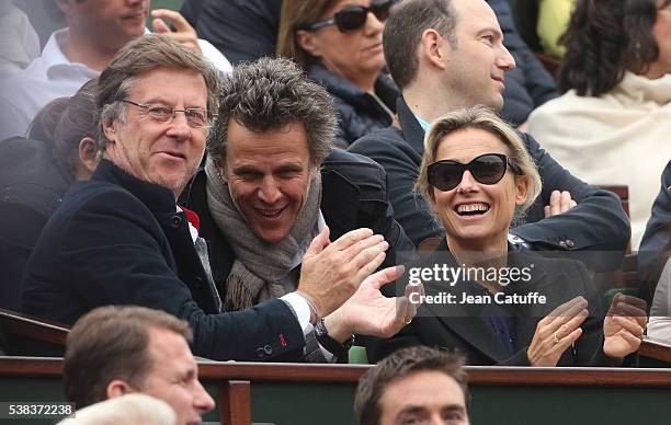 Accor CEO Sebastien Bazin, Anne-Sophie Lapix and her husband Arthur Sadoun attend the Men's Singles final between Novak Djokovic of Serbia and Andy...