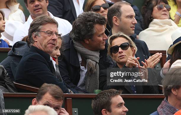 Accor CEO Sebastien Bazin, Anne-Sophie Lapix and her husband Arthur Sadoun attend the Men's Singles final between Novak Djokovic of Serbia and Andy...