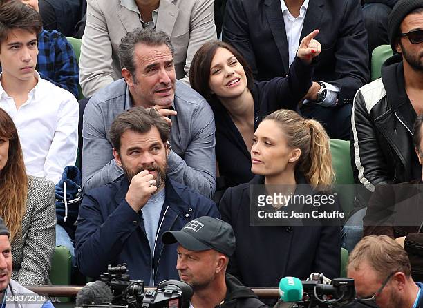 Jean Dujardin and his partner Nathalie Pechalat, below them Clovis Cornillac and his wife Lilou Fogli attend the Men's Singles final between Novak...