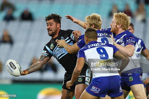 Andrew Fifita of the Sharks passes as he is tackled during the round 13 NRL match between the Canterbury Bulldogs and the Cronulla Sharks at ANZ...