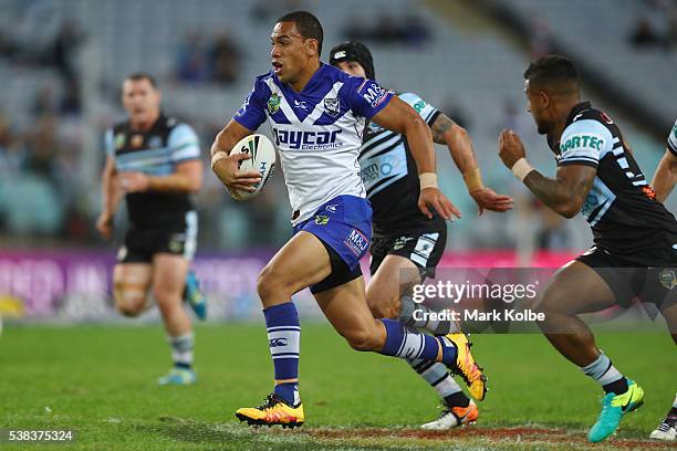 William Hopoate of the Bulldogs makes a break during the round 13 NRL match between the Canterbury Bulldogs and the Cronulla Sharks at ANZ Stadium on...