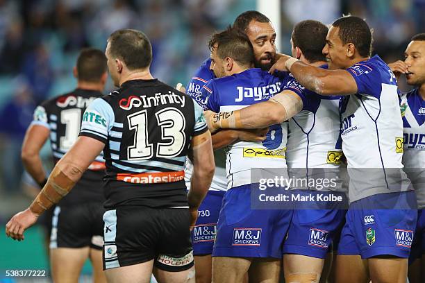 Sam Kasiano of the Bulldogs celebrates with his team mates after scoring a try during the round 13 NRL match between the Canterbury Bulldogs and the...