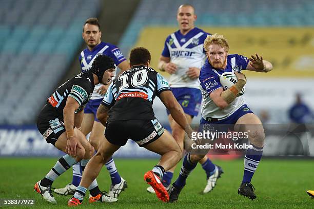 James Graham of the Bulldogs runs the ball during the round 13 NRL match between the Canterbury Bulldogs and the Cronulla Sharks at ANZ Stadium on...