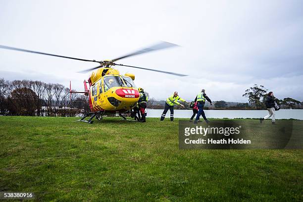 The Westpac rescue helicopter assists with the evacuation of residents after the Mersey River breaks its banks and floods several small towns cutting...