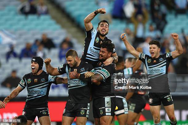 Michael Ennis, Wade Graham, Jack Bird, Andrew Fifita and Chad Townsend of the Sharks celebrate victory during the round 13 NRL match between the...