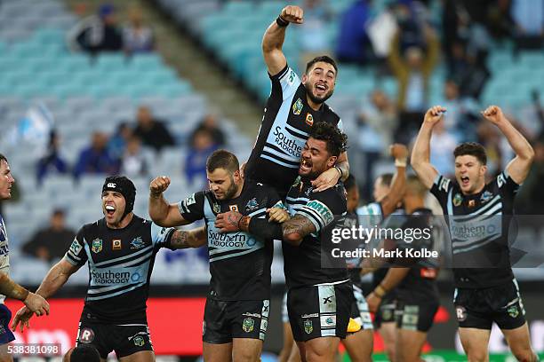 Michael Ennis, Wade Graham, Jack Bird, Andrew Fifita and Chad Townsend of the Sharks celebrate victory during the round 13 NRL match between the...