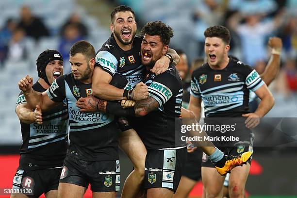 Michael Ennis, Wade Graham, Jack Bird, Andrew Fifita and Chad Townsend of the Sharks celebrate victory during the round 13 NRL match between the...