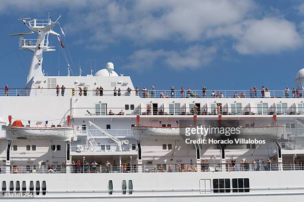 Passengers on board MS Thomson Spirit, a cruise ship owned by Holland America Line and operated under charter by the United Kingdom-based Thomson...