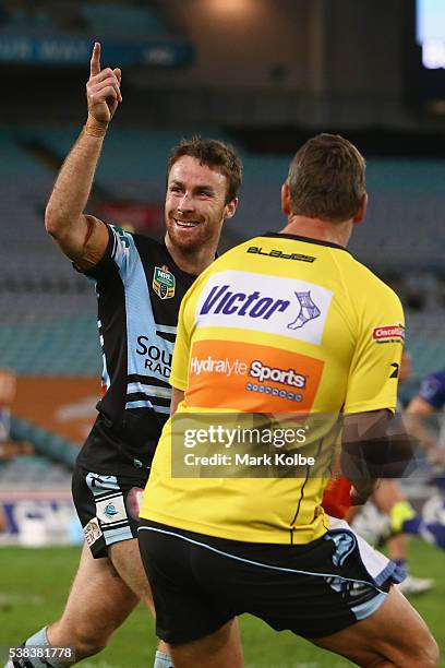 James Maloney of the Sharks celebrates kicking the goal to give the Sharks a 2 point lead during the round 13 NRL match between the Canterbury...