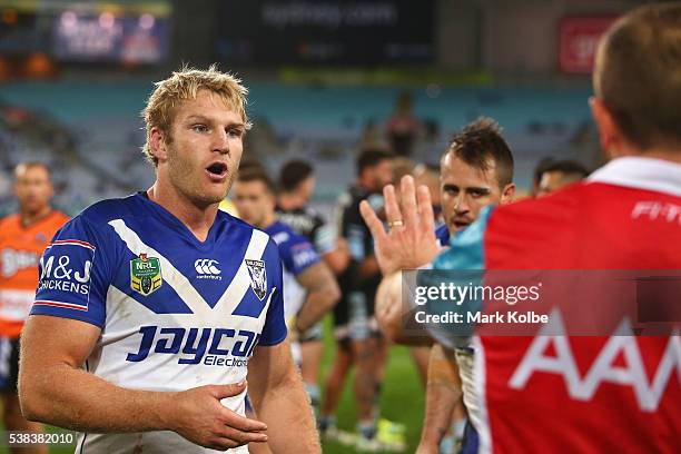 Aiden Tolman of the Bulldogs speaks to the referee Ben Cummins during the round 13 NRL match between the Canterbury Bulldogs and the Cronulla Sharks...