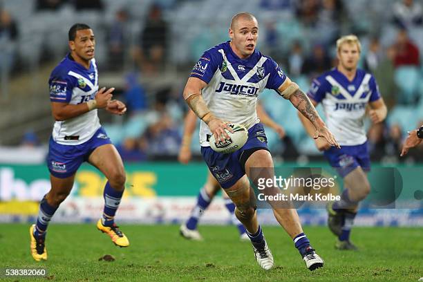 David Klemmer of the Bulldogs runs the ball during the round 13 NRL match between the Canterbury Bulldogs and the Cronulla Sharks at ANZ Stadium on...