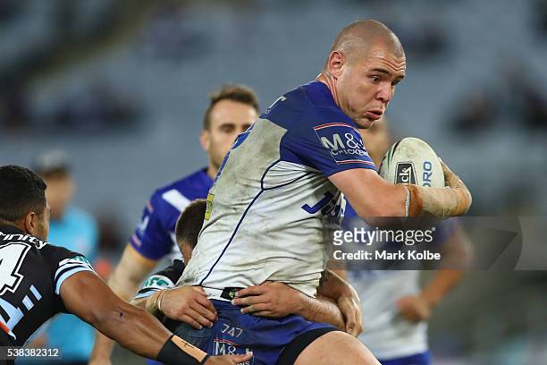 David Klemmer of the Bulldogs runs the ball during the round 13 NRL match between the Canterbury Bulldogs and the Cronulla Sharks at ANZ Stadium on...