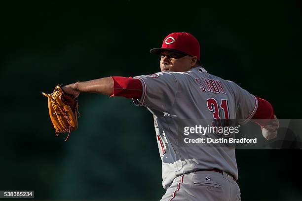 Alfredo Simon of the Cincinnati Reds pitches against the Colorado Rockies in the first inning of a game at Coors Field on June 2, 2016 in Denver,...