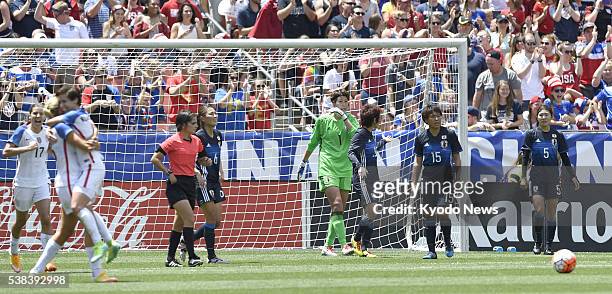 Americans celebrate after Julie Johnston opens the scoring in the 27th minute of the second of two U.S.-Japan women's friendly matches in Cleveland,...