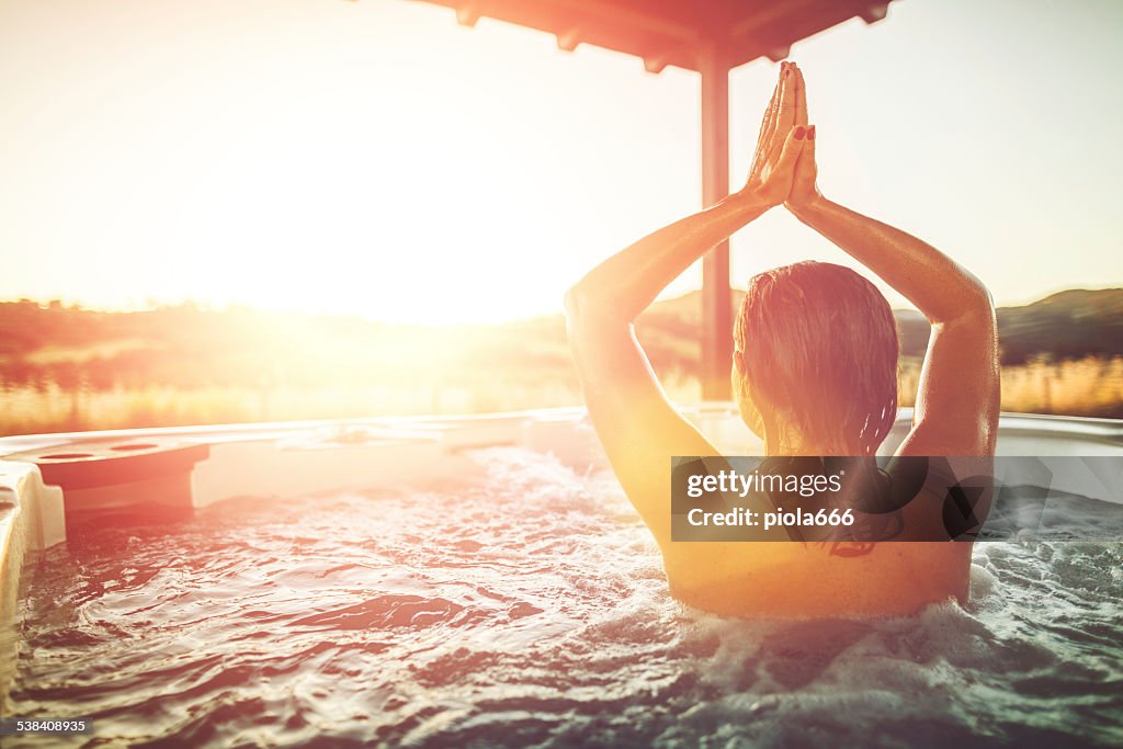 Woman relaxing in whirlpool hot tub