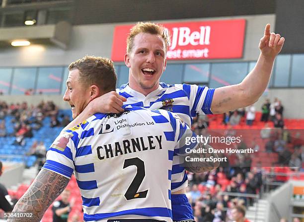 Wigan Warriors' Josh Charnley , is congratulated on scoring his team's 3rd try by team mate Dan Sarginson during the First Utility Super League Round...