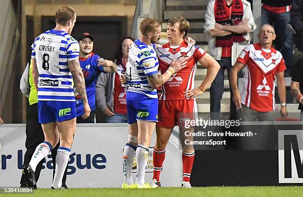 Brotherly love. Wigan Warriors' Sam Tomkins consoles Salford Red Devils' Logan Tomkins at the final whistle during the First Utility Super League...