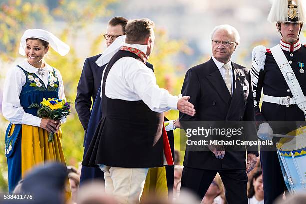 Carl XVI Gustaf and Princess Victoria of Sweden arrive at a ceremony celebrating Sweden's national day at Skansen on June 6, 2015 in Stockholm,...