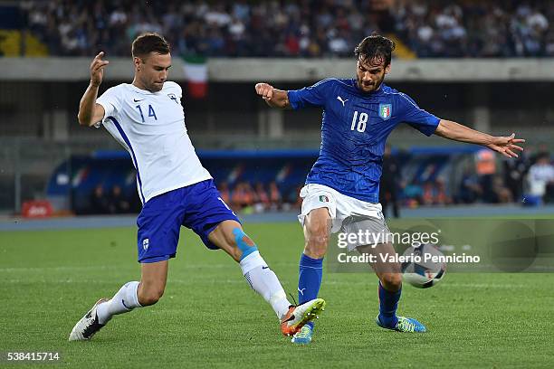 Marco Parolo of Italy is challenged by Tim Sparv of Finland during the international friendly match between Italy and Finland on June 6, 2016 in...