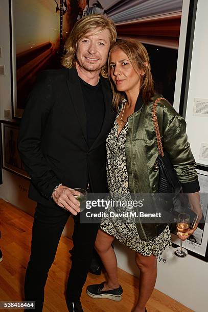 Nicky Clarke and Azzi Glasser attend a private view of new exhibition 'David Bowie: Fame, Fashion, Photography' at The Hub on June 6, 2016 in London,...