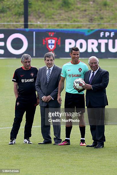Portugal's forward Cristiano Ronaldo , FPF's President Fernando Gomes and Portugal's head coach Fernando Santos pose for a photo with Portugal's...