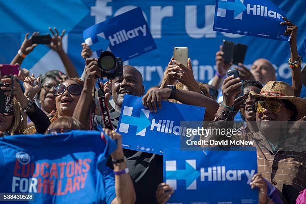 Supporters cheer as Democratic presidential candidate Hillary Clinton arrives to the South Los Angeles Get Out The Vote Rally at Leimert Park Village...