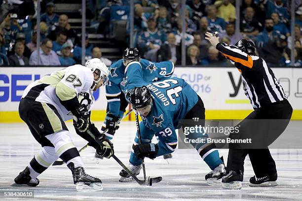 Logan Couture of the San Jose Sharks and Sidney Crosby of the Pittsburgh Penguins take the opening face-off in Game Four of the 2016 NHL Stanley Cup...