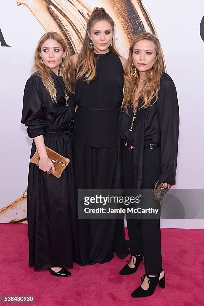 Elizabeth Olsen and Mary-Kate and Ashley attend Olsen the 2016 CFDA Fashion Awards at the Hammerstein Ballroom on June 6, 2016 in New York City.